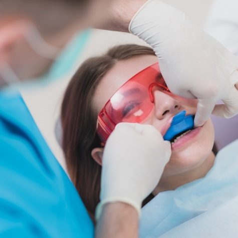 Dental patient receiving fluoride treatment