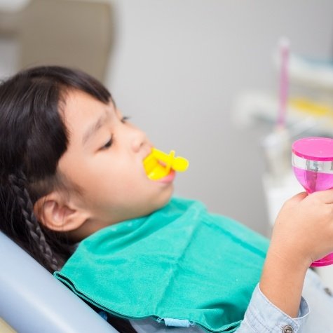 Child receiving fluoride treatments