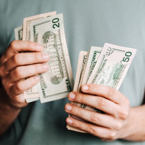 Man’s hands counting cash