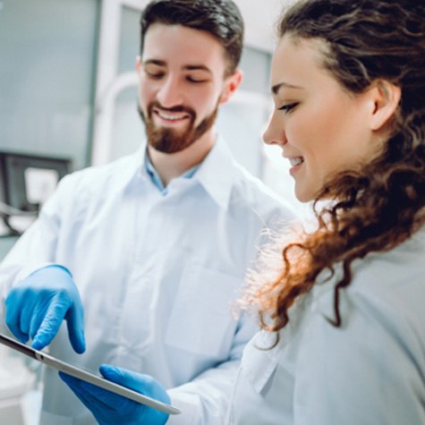 woman talking to cosmetic dentist