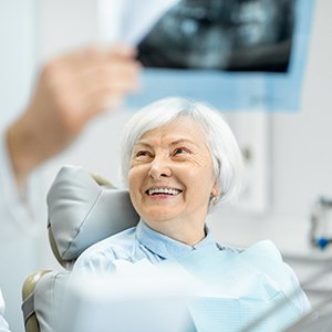 patient smiling while visiting dentist 