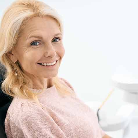 Patient in Houston smiling with dentures