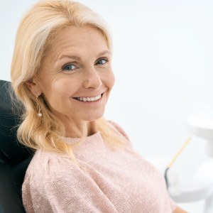 Woman smiling in the dental chair