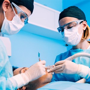 Dentists performing surgery