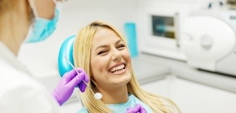 Dental patient smiling during preventive dentistry visit