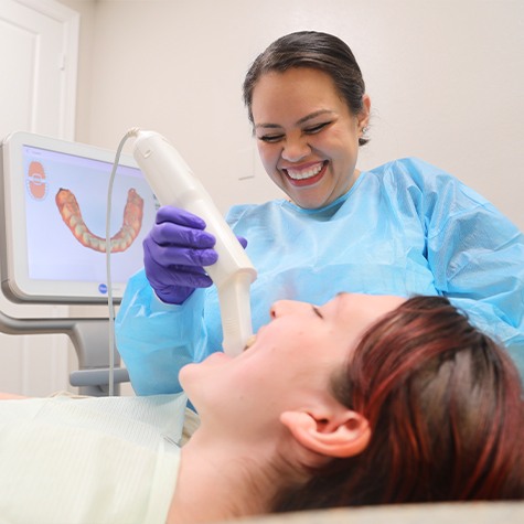 Dentist holding intraoral camera