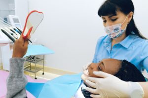 Female patient having consultation with dentist